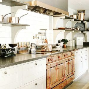 Kitchen with bronze oven and open shelving