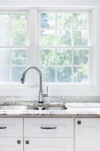 Kitchen sink and faucet with marble countertops