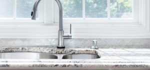 Kitchen sink and faucet with marble countertops